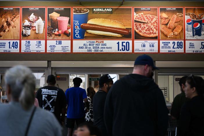Customers wait in line at a Costco food court in Hawthorne, California.  