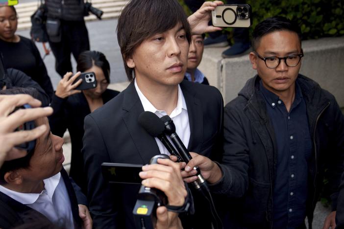 Ippei Mizuhara outside federal court on Tuesday after he pleaded guilty to two counts related to the transfer of nearly $17 million from the bank account of baseball star Shohei Ohtani to cover Mizuhara's gambling debts. 