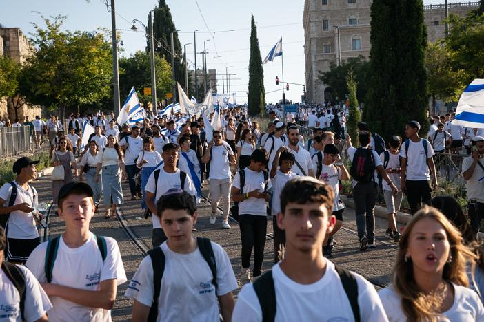 Tens of thousands of Israelis marched through the streets of Jerusalem Wednesday to mark Jerusalem Day. The march begins in west Jerusalem and travels through east Jerusalem and the Muslim Quarter of the Old City, ending at the Western Wall. The march marks the anniversary of the Six-Day War in 1967, when Israel annexed east Jerusalem, including the Western Wall.