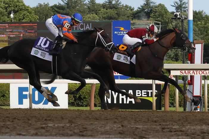 Dornoch, (6), with Luis Saez up, crosses the finish line ahead of Mindframe (10), with Irad Ortiz Jr. up, to win the 156th running of the Belmont Stakes horse race on Saturday in Saratoga Springs, N.Y.