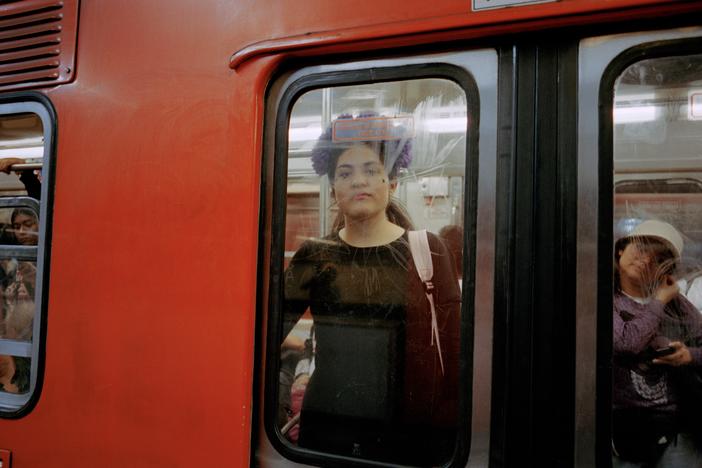  A woman in the window of a women-only metro car in Mexico City in October 2023.