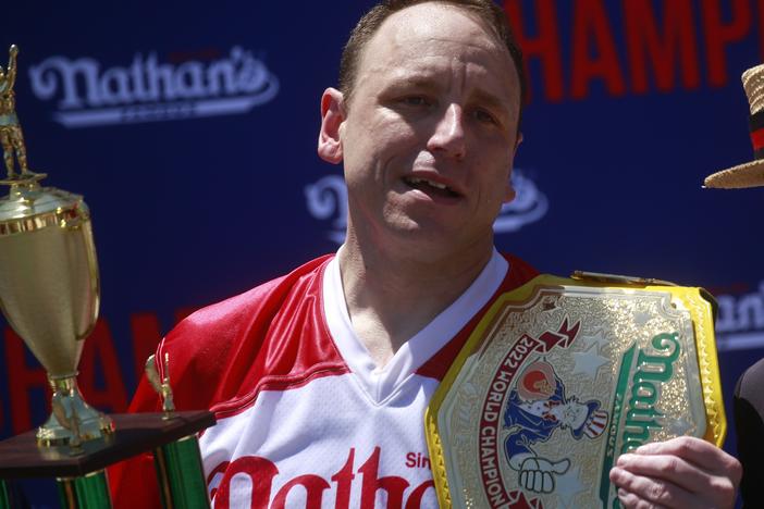 Joey Chestnut emerges victorious after eating 63 hot dogs in 10 minutes during the 2022 Nathans Famous Fourth of July International Hot Dog Eating Contest in New York City.
