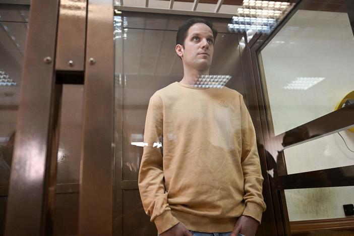 U.S. journalist Evan Gershkovich stands inside a defendants' cage during a pretrial detention hearing at the Moscow City Court in Moscow on Sept. 19, 2023. Gershkovich was detained during a reporting trip in Russia in March 2023 and accused of spying — charges that he, the U.S. government and his employer, <em>The Wall Street Journal</em>, vehemently deny. 