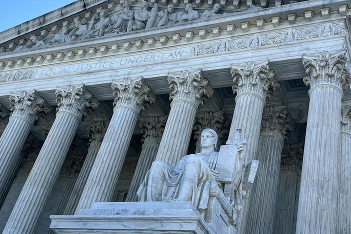 The statue Guardian or Authority of Law sits above the west front plaza of the U.S. Supreme Court on June 7 in Washington, D.C. Among the rulings the court is expected to issue by the end of June are cases about access to abortion pills dispensed by mail, gun restrictions, the power of regulatory agencies and former President Donald Trump’s bid to avoid criminal charges for trying to overturn his 2020 election defeat.