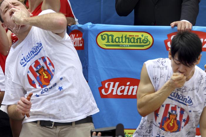 Joey Chestnut (L) and Takeru Kobayashi (R) compete in the Nathan's hot dog-eating contest on July 4, 2009, in New York. The longtime rivals haven't faced off again since — but are slated for a rematch this Labor Day. 