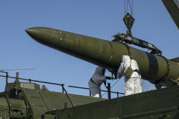 In this photo released by Russian Defense Ministry Press Service on Friday, Feb. 2, 2024, Russian troops load an Iskander missile onto a mobile launcher during drills at an undisclosed location in Russia.