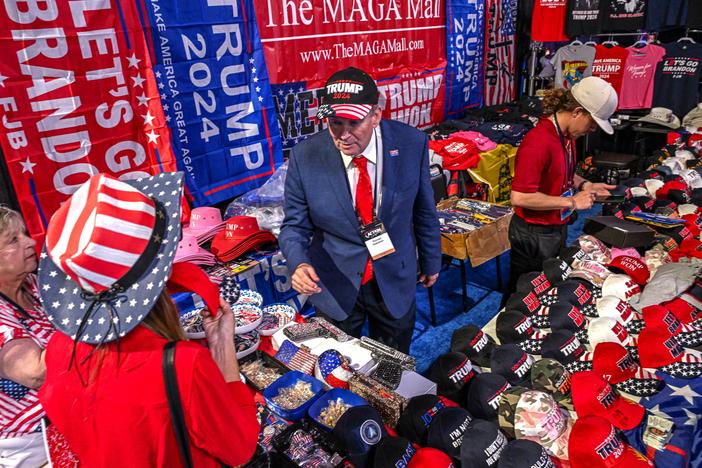 A vendor sells 2024 Donald Trump campaign souvenirs at the Turning Point Action USA conference in West Palm Beach, Flo., in 2023.
