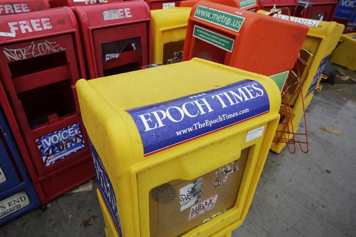  A 2013 file photo of an Epoch Times newspaper box in New York City. The outlet was founded by adherents to the Falun Gong spiritual movement but it has morphed into a pro-Trump conservative news organization in recent years. Earlier this month, the organization's chief financial officer was arrested on federal money laundering charges.