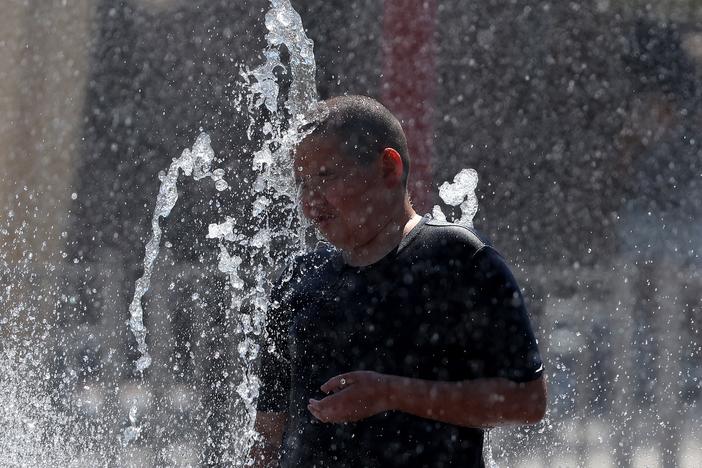 A boy plays in a splash pad at Riverview Park on June 05, 2024 in Mesa, Arizona.