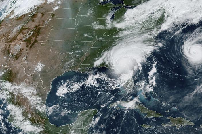 A satellite image provided by the National Oceanic and Atmospheric Administration shows Hurricane Idalia, center, over Florida and crossing into Georgia, and Hurricane Franklin, right, as it moves along off the East coast of the U.S., on Aug. 30, 2023.