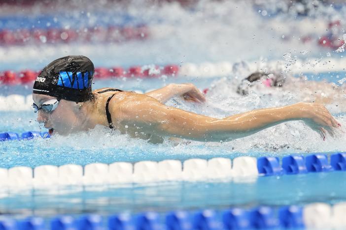 Gretchen Walsh swims during the Women's 100 butterfly finals on Sunday at the U.S. Swimming Olympic Trials in Indianapolis.