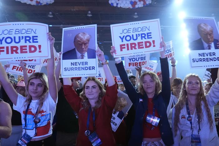 People arrive before Republican presidential candidate former President Donald Trump speaks at the "People's Convention" of Turning Point Action Saturday in Detroit.