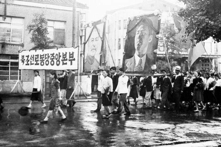 Part of a welcome for the United States-Soviet commission on Korea on their arrival in Pyongyang on July 23, 1947, was this parade of Korean communists carrying huge portraits of Josef Stalin and Kim Il Sung. The commission visited Pyongyang, 165 miles north of Seoul, for the purpose of getting views of political groups on the prospecting.