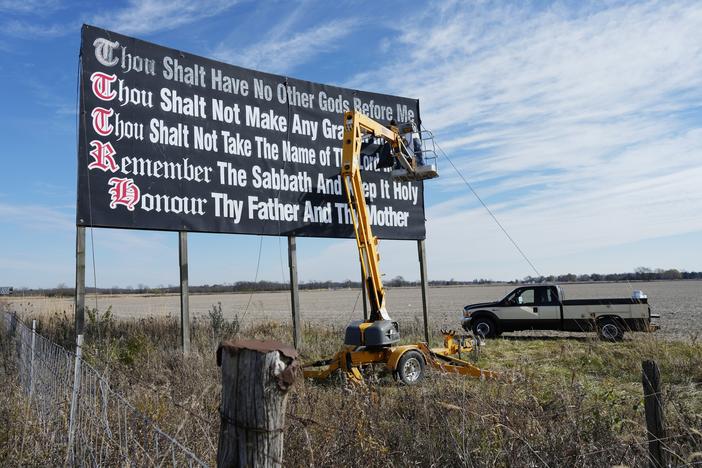 Louisiana has become the first state to require that the Ten Commandments be displayed in every public school classroom under a bill signed into law by Republican Gov. Jeff Landry on Wednesday. Above, workers repaint a Ten Commandments billboard off of Interstate 71 near Chenoweth, Ohio, on Nov. 7, 2023. 