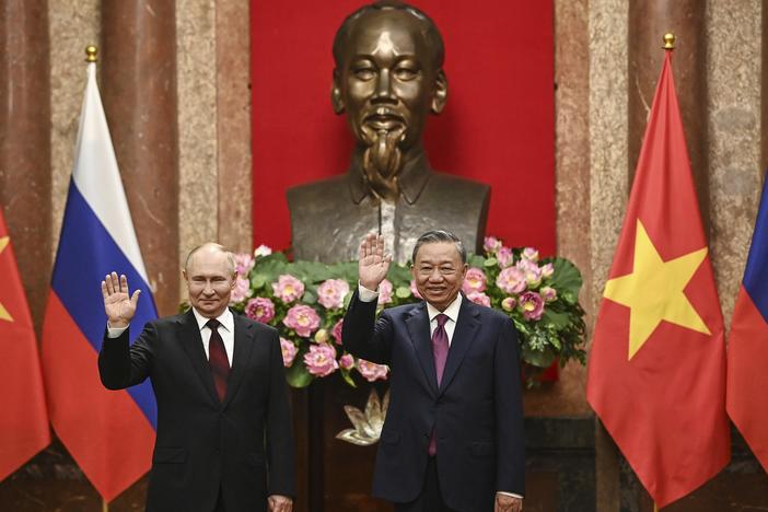 Russian President Vladimir Putin (left) and Vietnam's President To Lam pose for photos at the Presidential Palace in Hanoi, Vietnam, on Thursday.