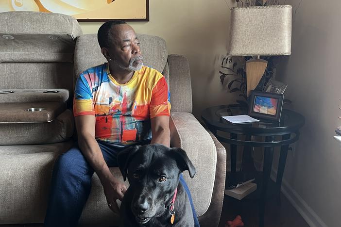 Malcolm Reid at home in Decatur, Georgia, with his dog, Sampson. Reid, who recently marked his 66th birthday and the anniversary of his HIV diagnosis, is part of a growing group of people 50 and older living with the virus.