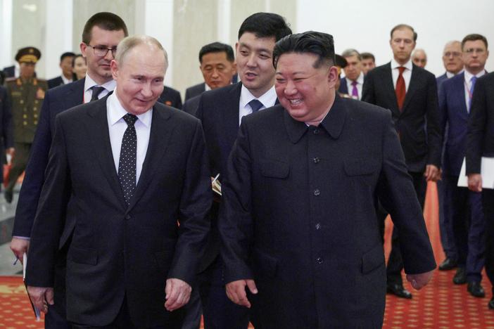 In this pool photograph distributed by the Russian state agency Sputnik, Russian President Vladimir Putin (left) and North Korea's leader Kim Jong Un attend a gala concert in Pyongyang, on Wednesday.