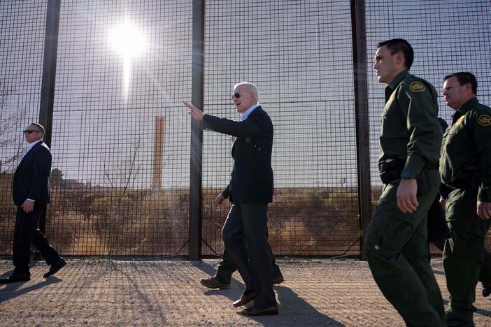 US President Joe Biden walks along the US-Mexico border fence in El Paso, Texas, on January 8, 2023.