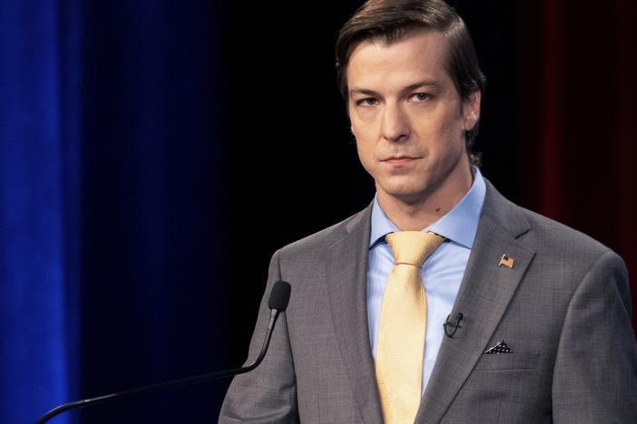 In this file photo from 2022, Libertarian Chase Oliver, then a candidate for Georgia's U.S. Senate seat, listens during a debate in Atlanta, Ga. The Libertarian Party nominated party activist Oliver for president as the party's candidate in the 2024 election, rejecting former President Donald Trump and Robert F. Kennedy Jr. after they each spoke at the party's convention. (AP Photo/Ben Gray, File)