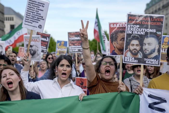 Protesters attend a rally against a death sentence given to Toomaj Salehi, a popular rapper in Iran, and to support to the women of Iran, in Berlin, Germany, on Sunday, April 28, 2024.  Iran's Supreme Court overturned Salehi's death sentence on Saturday, June 22, 2024, his lawyer Amir Raisian said.