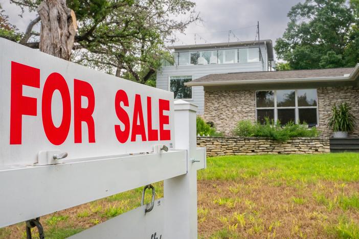 Home prices hit a record high in May even as home sales fell.  High interest rates are keeping many would-be buyers and sellers on the sidelines.  