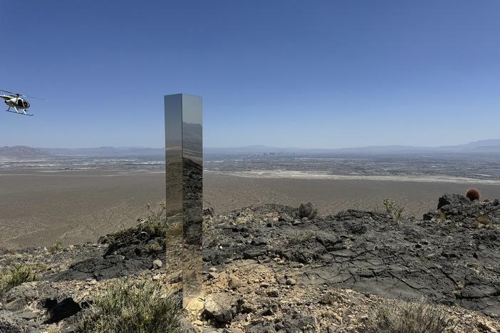 This photo provided by the Las Vegas Metropolitan Police Department shows the monolith found in Gass Peak in Nevada's Desert National Wildlife Refuge.