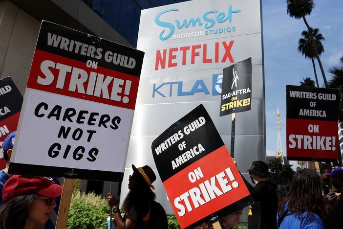 Striking Writers Guild members picket alongside SAG-AFTRA members outside Netflix studios in September 2023. 