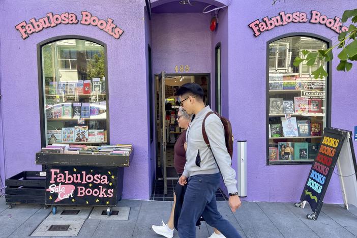 Pedestrians walk past the Fabulosa Books store in San Francisco's Castro District on Thursday. The bookstore is sending LGBTQ+ books to parts of the country where they are censored to counter the rapidly growing effort by anti-LGBTQ+ activists and lawmakers to ban queer-friendly books from public schools and libraries.