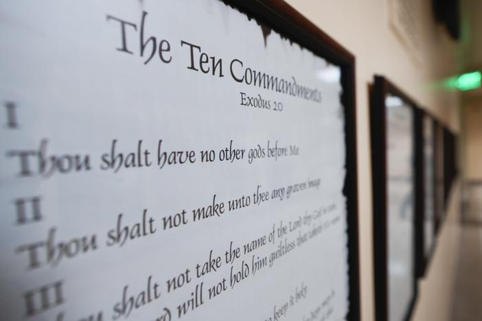 A copy of the Ten Commandments is seen along with other historical documents in a hallway of the Georgia Capitol on June 20 in Atlanta. Civil liberties groups filed a lawsuit on June 24 challenging Louisiana’s new law that requires the Ten Commandments to be displayed in every public school classroom.