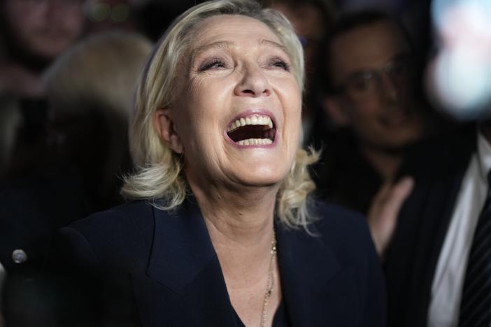French far right leader Marine Le Pen reacts as she meets supporters and journalists after the release of projections based on the actual vote count in select constituencies on Sunday in Henin-Beaumont, northern France. 