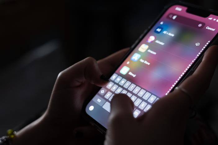 A teenager uses her mobile phone to access social media on Jan. 31, 2024, in New York City. The city may soon become the largest school district in the nation to ban cellphones for students. 