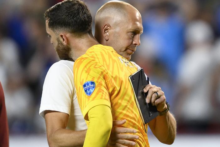 Coach Gregg Berhalter of the United States greets goalkeeper Matt Turner after losing 0-1 against Uruguay at the end of a Copa America Group C soccer match in Kansas City, Mo., on Monday.