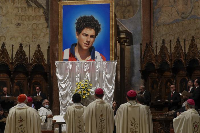 An image of 15-year-old Carlo Acutis is unveiled during his beatification ceremony at the St. Francis Basilica in Assisi, Italy, in October 2020.  