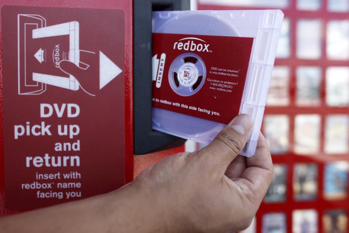 A rental DVD is dispensed from a Redbox at a 7-Eleven in Los Angeles in 2009. Chicken Soup for the Soul Entertainment, the owner of Redbox, filed for Chapter 11 bankruptcy protection on Friday.