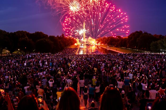 Spectators watch as fireworks erupt over the Washington Monument on July 4, 2022, in Washington, D.C.