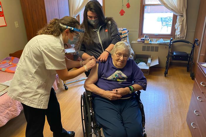 Mary Ann Herbst, a patient at the Good Samaritan Society nursing home in Le Mars, Iowa, gets her first COVID-19 vaccine shot on Dec. 29, 2020. A recent study found only 4 out of 10 nursing home residents in the U.S. have gotten at least one dose of the most recent COVID vaccine, which was released last fall.<br>