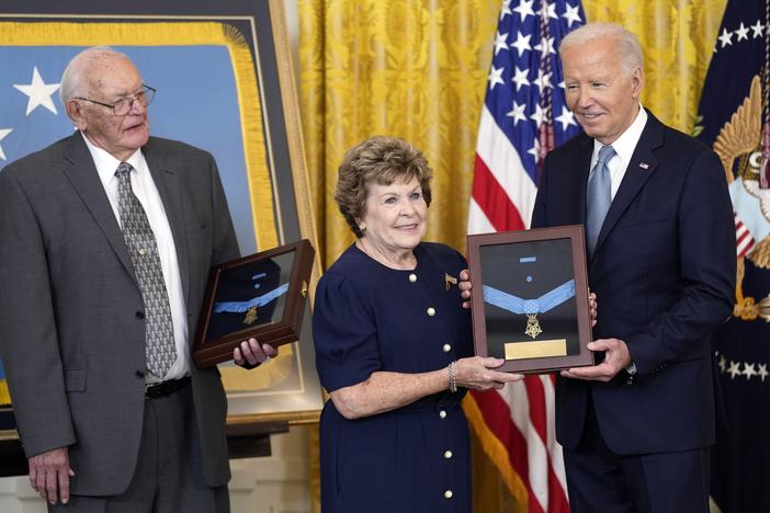 President Biden presents the Medal of Honor to Theresa Chandler, the great-great-granddaughter of Pvt. George D. Wilson in the East Room at the White House in Washington, on Wednesday. The medals posthumously honor two U.S. Army privates who were part of a daring Union Army contingent that stole a Confederate train during the Civil War. U.S. Army Pvts. Philip G. Shadrach and George D. Wilson were captured by Confederates and executed by hanging. At left is Gerald Taylor, the great-great-nephew of Pvt. Phil…