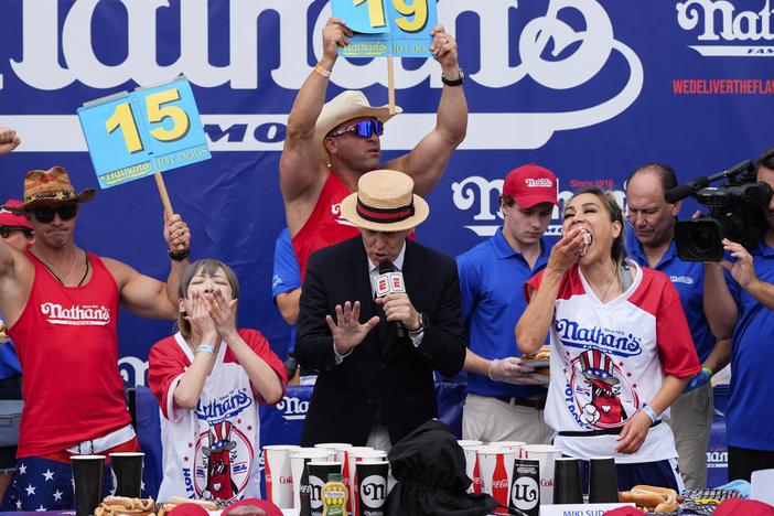 Miki Sudo (right) and Mayoi Ebihara compete in the women's division of Nathan's Famous Fourth of July hot dog eating contest, Thursday, at Coney Island in the Brooklyn borough of New York. Sudo won by eating a record 51 hot dogs.