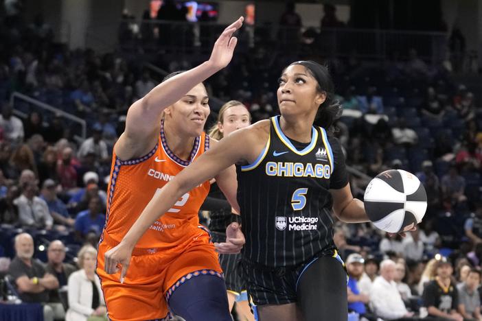 Chicago Sky's Angel Reese (5) eyes the basket as Connecticut Sun's Brionna Jones defends during a WNBA basketball game on June 12, 2024, in Chicago. 