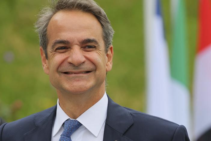 Greek Prime Minister Kyriakos Mitsotakis arrives to take part in a Ukraine peace summit near Lucerne, Switzerland, on June 15. Mitsotakis' administration says making six days of work mandatory is necessary due to a shrinking population and a shortage of skilled workers.
