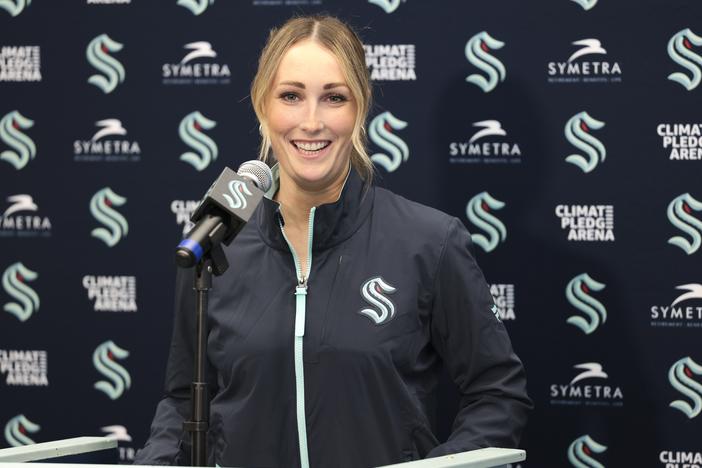 Seattle Kraken new assistant coach Jessica Campbell speaks during an NHL hockey press conference Wednesday in Seattle. Campbell will become the first woman to work on the bench of an NHL franchise after the team hired her as an assistant coach.