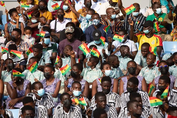 Students cheers from the stands during the celebrations for Ghana 65th Independence Day on March 6, 2022. The country gained independence on March 6, 1957. The author of this article recalls his boyhood celebrations — which involved uniforms, marching and a free bottle of soda.