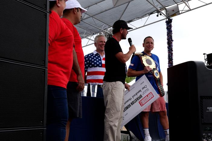 Joey Chestnut (right) won a hot dog-eating contest against soldiers at Fort Bliss in El Paso, Texas, on Thursday, with Impossible Foods pledging to donate $1,000 in support of military families for each hot dog downed. 