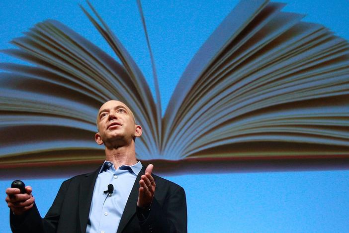 Amazon founder Jeff Bezos speaks at an event unveiling the Kindle 2.0 in 2009. Bezos founded the company in his Bellevue, Wash. garage 30 years ago on July 5, 1995.