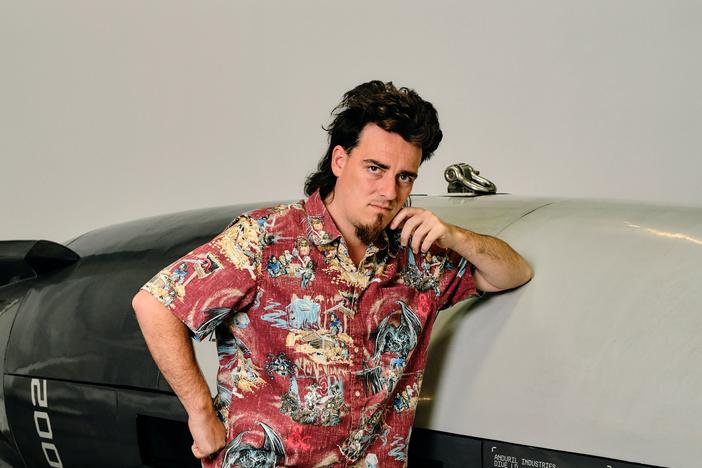 Palmer Luckey, 31, founder of Anduril Industries, stands in front of the Dive-LD, an autonomous underwater drone at company headquarters in Costa Mesa, Calif. Andruil recently won a U.S. Navy contract to build 200 of them annually. 