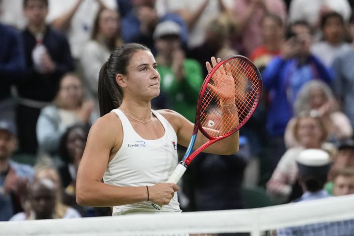 Emma Navarro of the United States celebrates after defeating compatriot Coco Gauff in their fourth round match at the Wimbledon tennis championships in London, Sunday, July 7, 2024. 