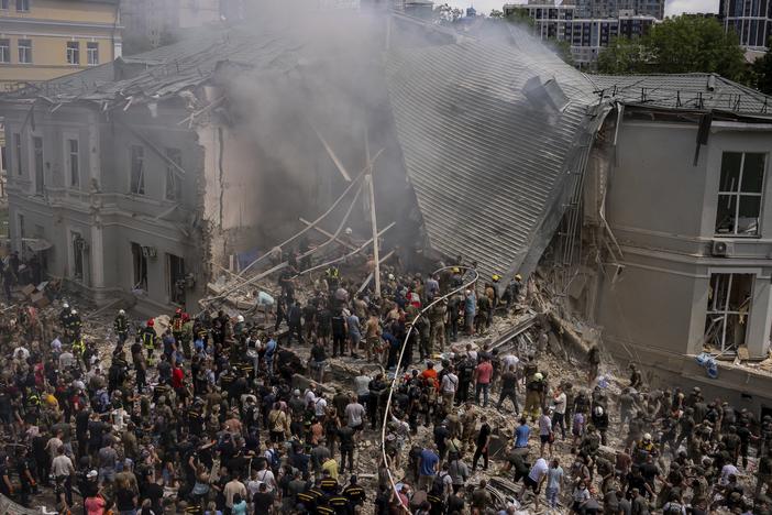 Emergency workers respond at the Okhmatdyt children's hospital hit by Russian missiles, in Kyiv, Ukraine, Monday.