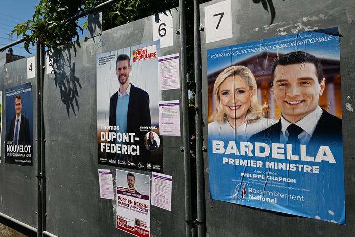Posters with images or names of local candidates for the first round of the 2024 French legislative elections displayed in front of the local town hall in Port-en-Bessin-Huppain, Normandy, France, on June 25. France will hold an early legislative election in two rounds, on June 30 and July 7.