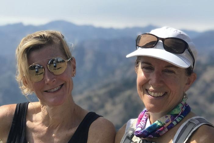  Molly Baker (right) poses with her unsung hero, Carla Vail, who came up with a novel way to support Baker after her husband died.