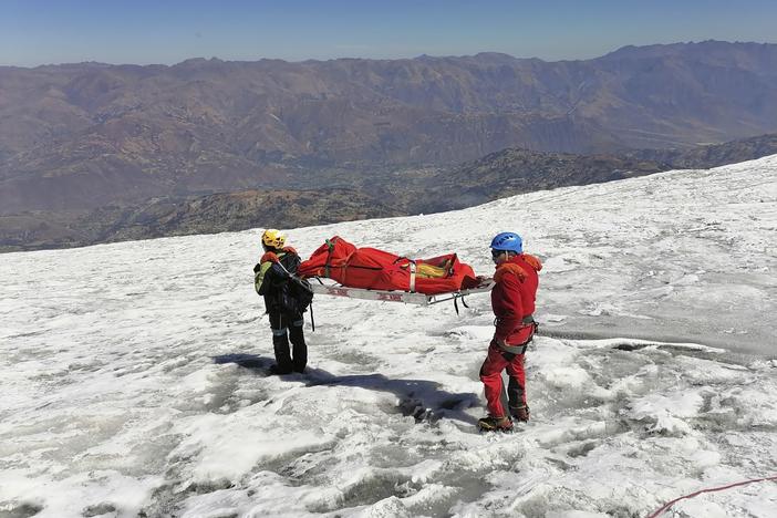 Police carry a body that they identify as U.S. mountain climber Bill Stampfl on Huascaran mountain in Huaraz, Peru, on Friday. Peruvian authorities said they found the mummified body of Stampfl, who died 22 years ago along with two other American climbers after they were trapped in an avalanche while trying to climb Peru's highest peak.